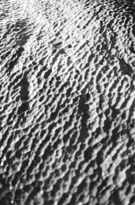 Eroded Marble Texture, 2019. From the analogue photography series The Inceptive Ground, texture volume 01. Black & white silver gelatin print, 50 × 60 cm. Edition of 3 + 1 AP.