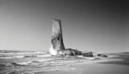 Lighthouse intervention rising from the Baltic Sea on the Curonian Spit, by Jurgis Gečys