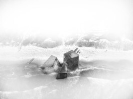 Conceptual photocollage of the Lighthouse intervention showing concrete boulders washed onto the Baltic Sea shore of the Curonian Spit