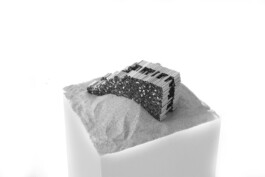 Windhouse construction model showing log formwork supported by sand before concrete is poured, by Jurgis Gečys