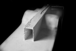 Detail view of the final plaster model of the Windhouse intervention, showing its elongated interior and partially perforated concrete shell