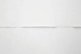 non-body-non-space, 2018. Top view detail of the white flour installation, showing a cracked surface divided by a narrow central ridge.