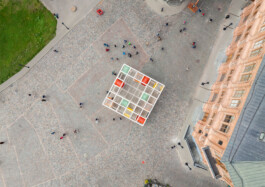 Aerial top view of Dome Next Door, 2024, showing the timber urban art installation within the public square of Riga Old Town, Latvia.