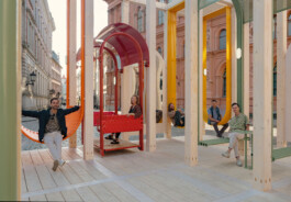 Creators of Dome Next Door seated within the completed timber urban art installation in Riga Old Town, Latvia.