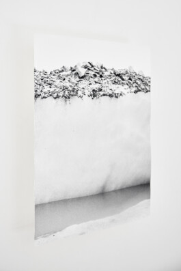 The Formation of Ground, 2018, black-and-white photograph by Jurgis Gečys showing a layered surface of rock, sediment and ice.