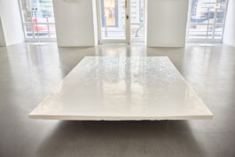 The Memory of the Ground, 2020, sculpture by Jurgis Gečys with video and audio projection, showing the projected crystalline light across the relief surface.