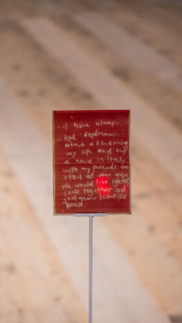 Detail of Unexposed, 2021, by Jurgis Gečys, showing a 4 × 5 inch photographic glass negative inscribed with a handwritten unrealised memory.